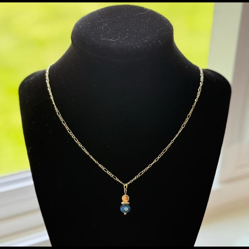 Handmade gold charm necklace.